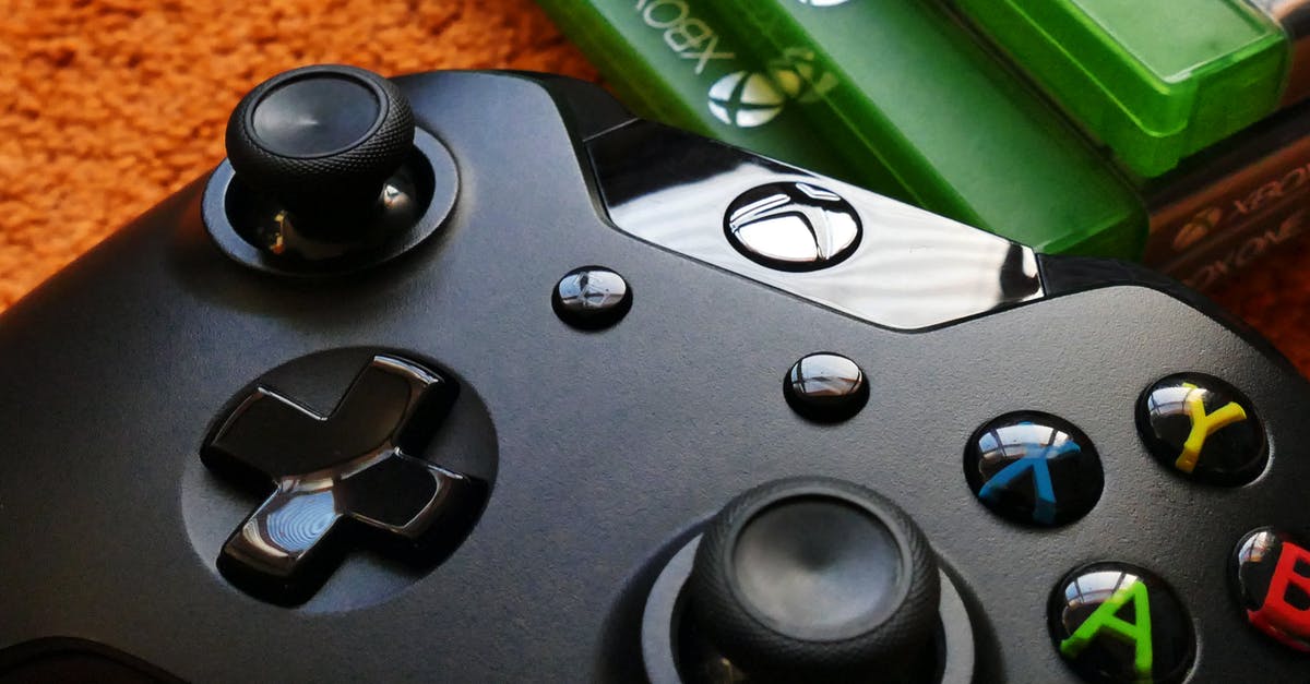 Xbox 360 dosen't recognise discs - Xbox One Controller Beside Three Xbox One Cases