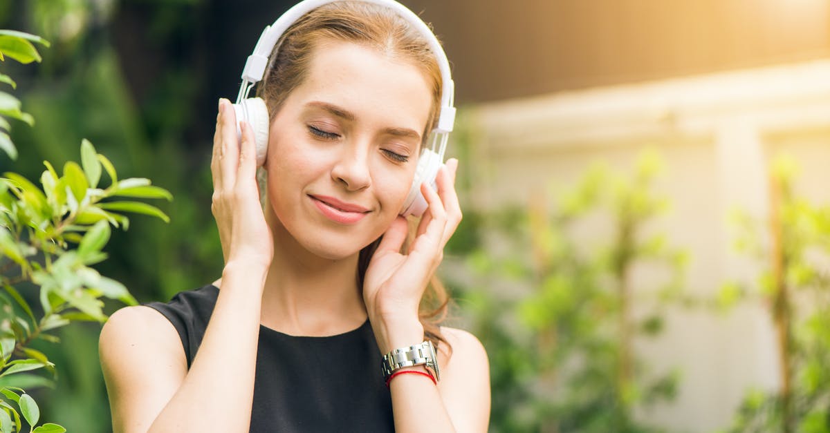Xbox 360 game sound through headset - Woman Wearing Black Sleeveless Dress Holding White Headphone at Daytime Xbox 360 game sound through headset - Woman Wearing Black Sleeveless Dress Holding White Headphone at Daytime