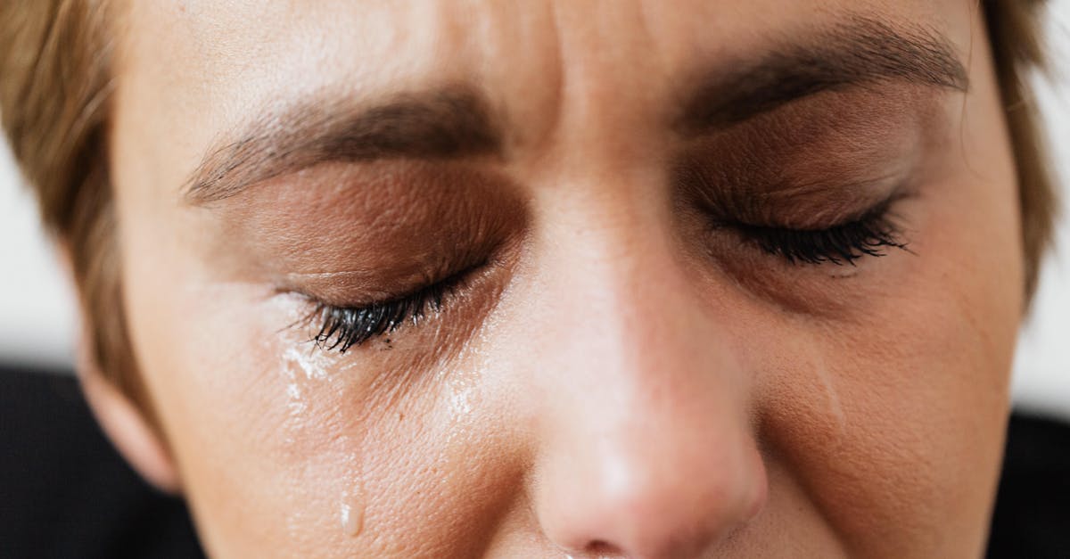 Xbox 360 start up problem - Tears on face of crop anonymous woman Xbox 360 start up problem - Tears on face of crop anonymous woman