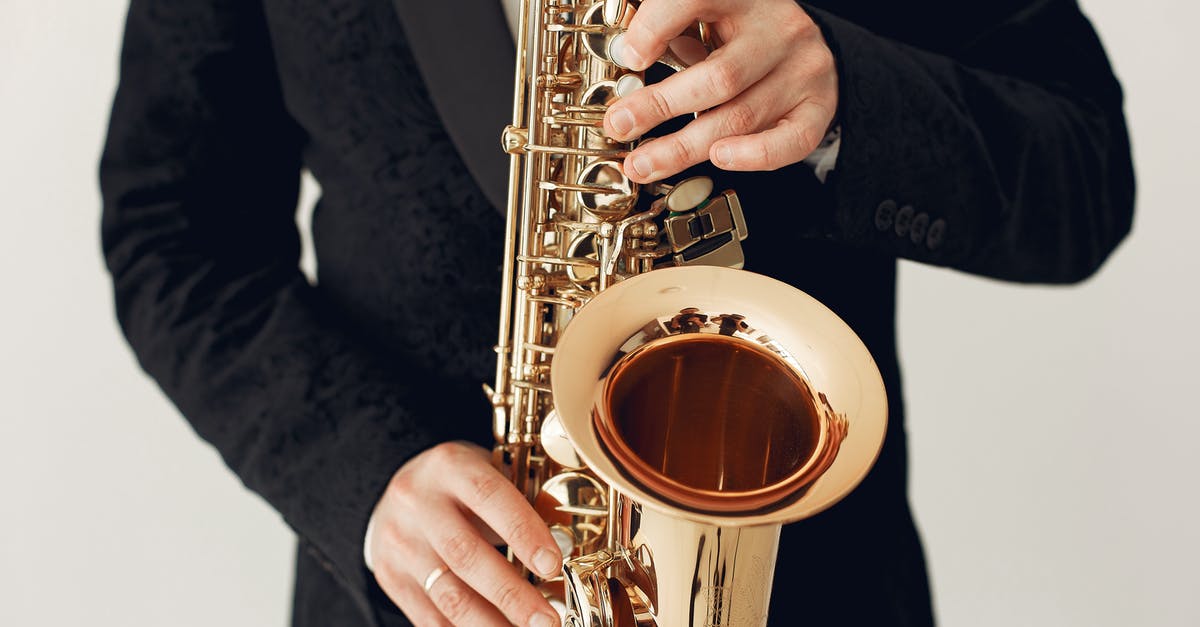 XBOX Live Gold Sharing - Crop man playing saxophone during concert