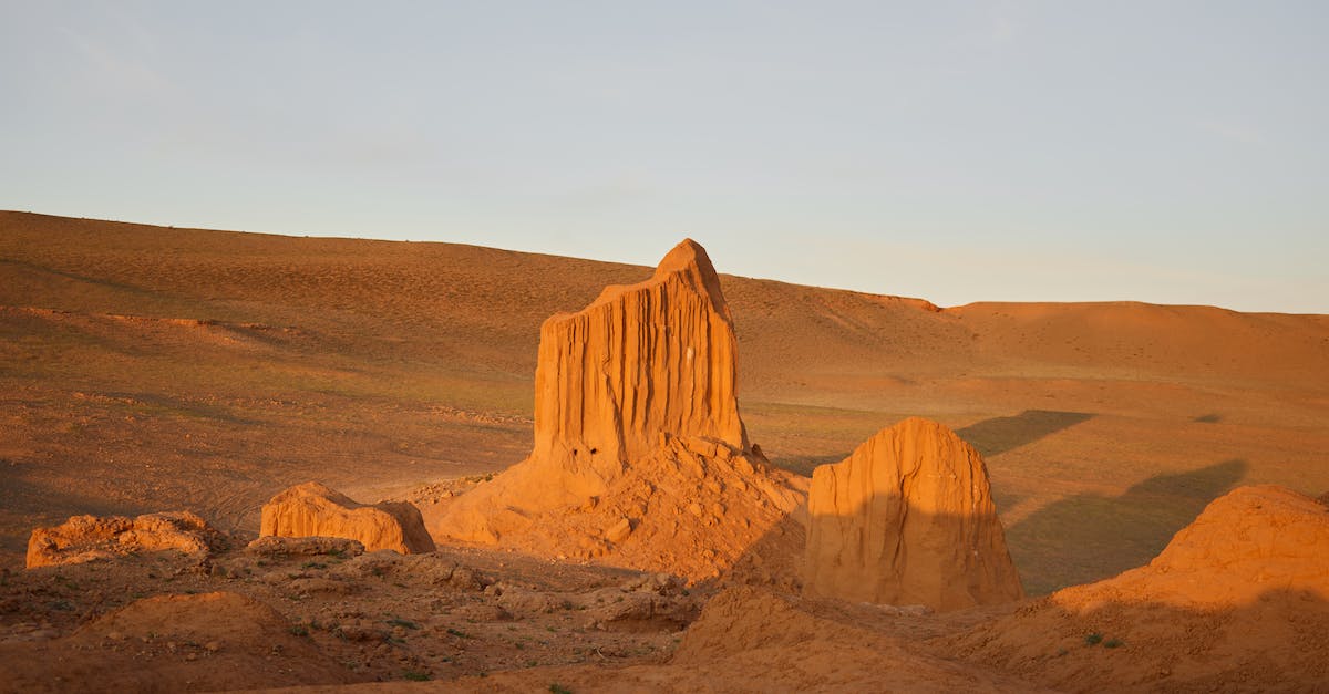 Zeroing the Long Range Scope with multiple zoom levels - Desert landscape with rocky mountains under clear blue sky