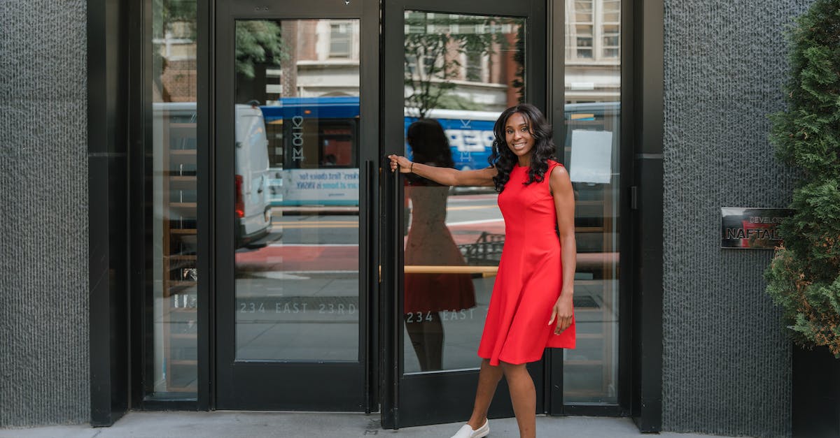 Zombie like thing opening my doors - Smiling woman opening door to office building
